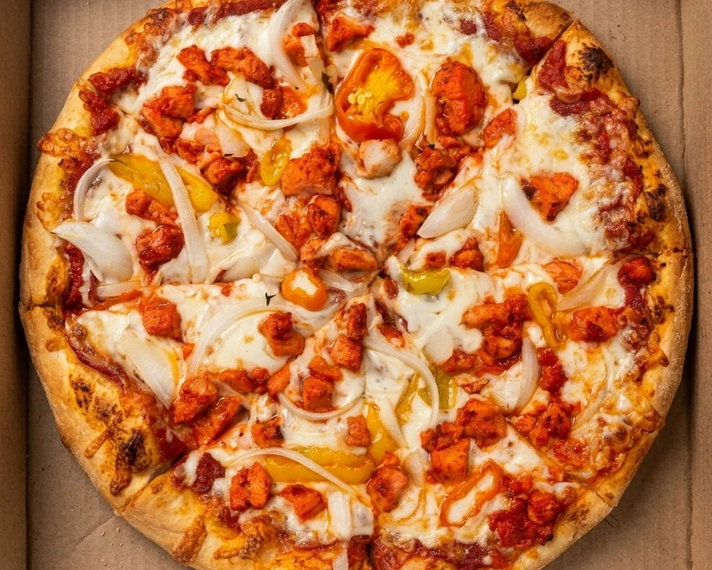 Tandoori Chicken Pizza with green pepper and onion at Pizza On Fire in Calgary SE